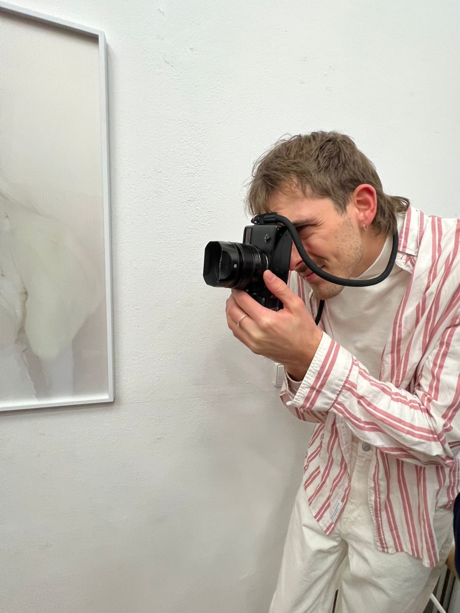 Jonathan Goudefroy photographing a work in the exhibition